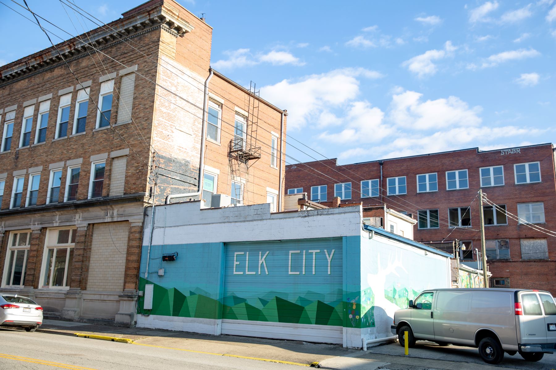 "Elk City" mural on downtown building, next to another under-utilized building