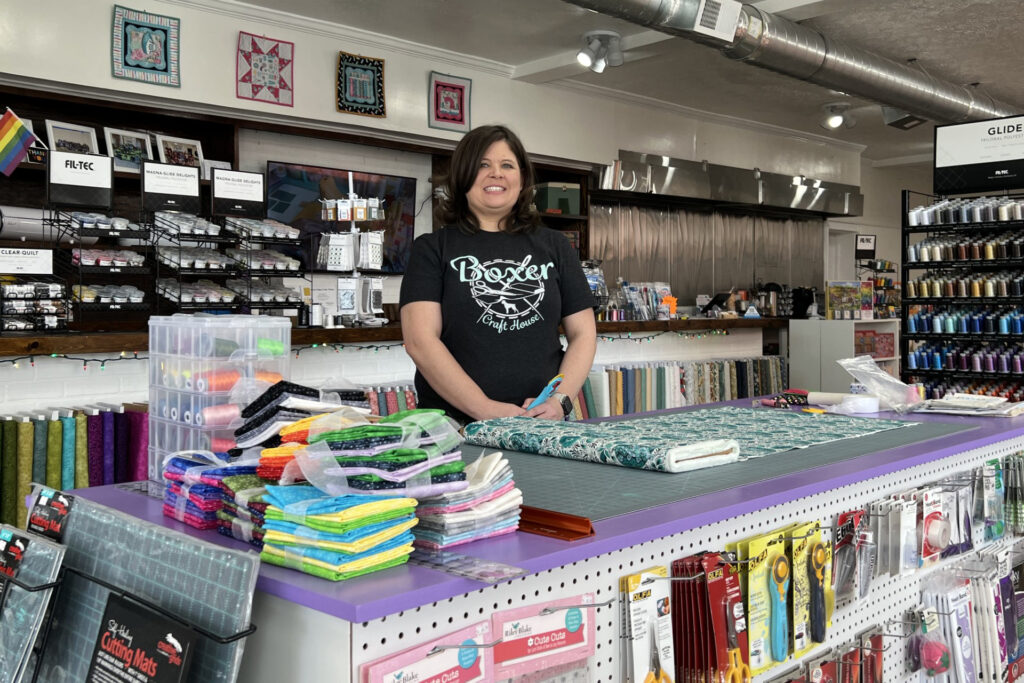 Boxer Craft House owner behind the counter at her stroefront.